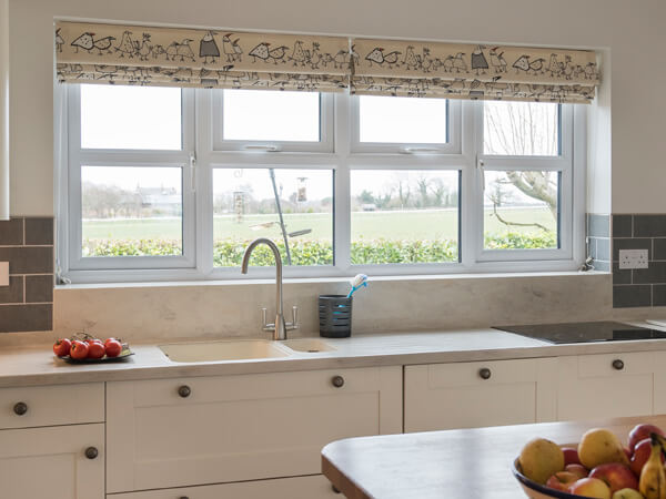 A kitchen space with a white colour scheme