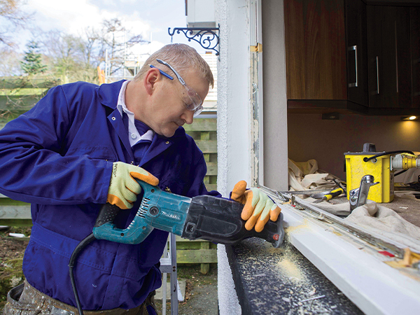 An installer completing a window installation