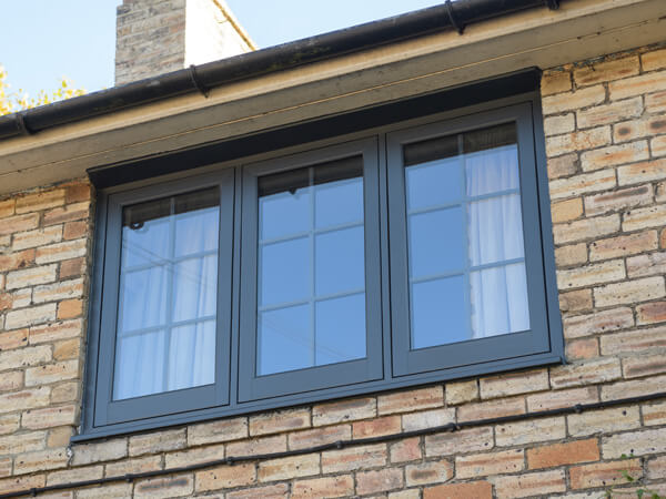 Grey flush windows with decorative leading